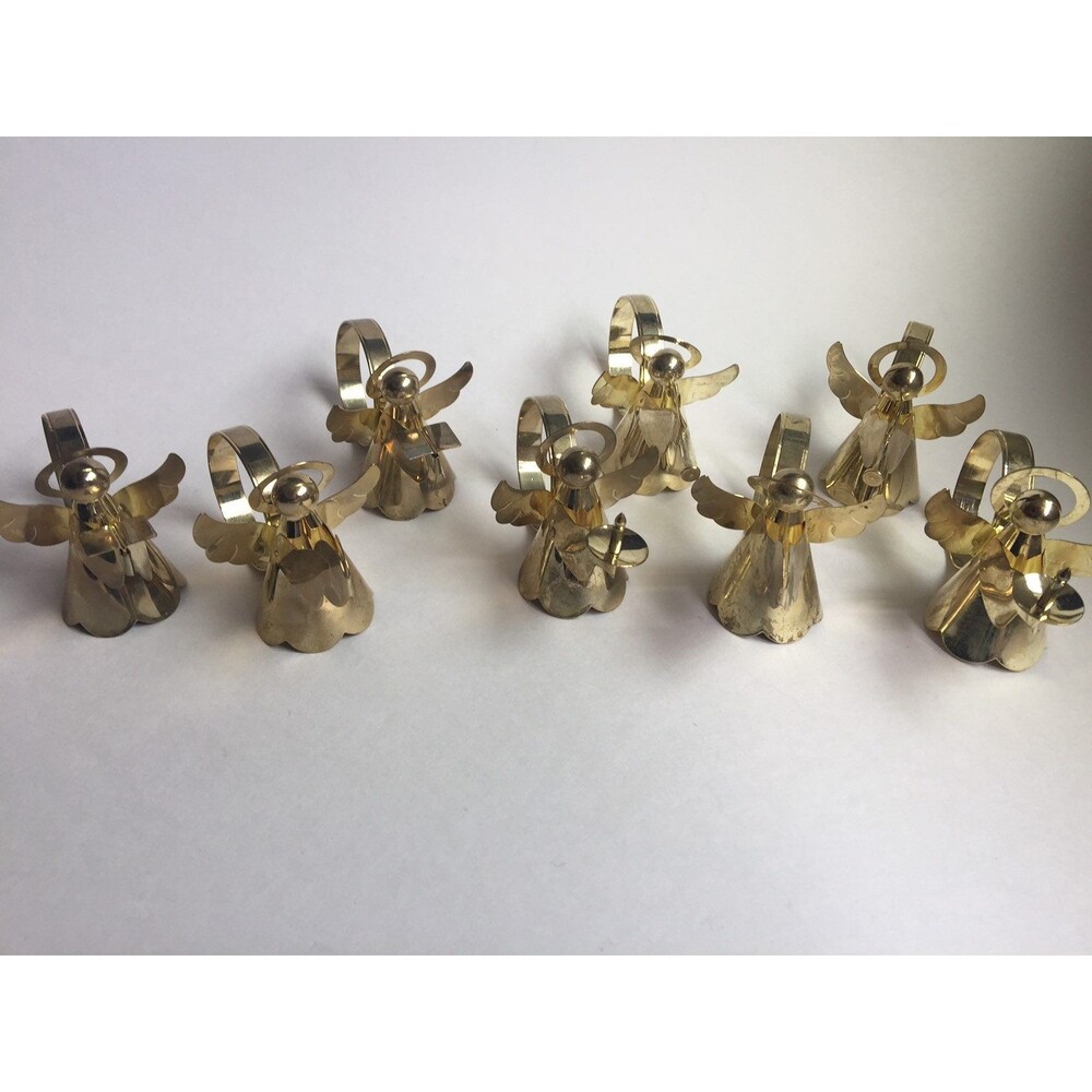 Set of 8 vintage napkin rings trumpet singing drums and candle